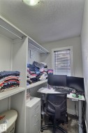 Built-in shelving and closet rods provide organization - 