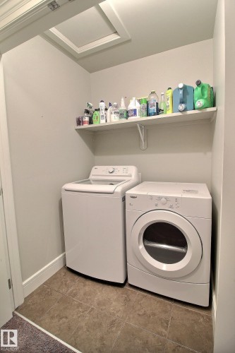 Tile flooring, white wall shelving, attic access panel - 35 Hudson Cove, Spruce Grove, AB 