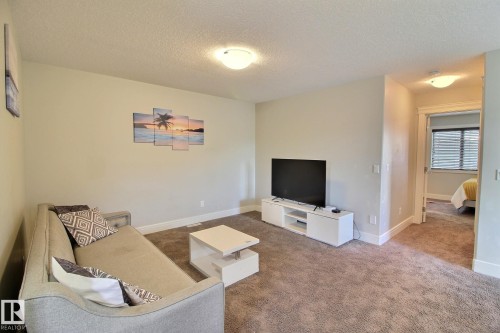 Carpeted interior with light-colored walls, recessed lighting, and white trim - 35 Hudson Cove, Spruce Grove, AB 