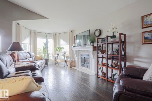 Wood-finish flooring throughout Gas Fireplace - 3815 41 Street Nw, Edmonton, AB 
