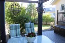 Deck 2 tiered with dark composite decking, black railing, and integrated storage box - 3815 41 Street Nw, Edmonton, AB 