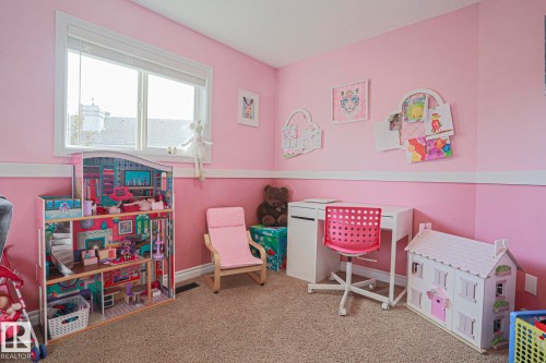 Carpeted flooring, wall-mounted picture rail, and a window with blinds - 3815 41 Street Nw, Edmonton, AB 