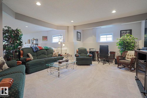 Recessed lighting, light gray carpeting, and multiple windows - 3815 41 Street Nw, Edmonton, AB 