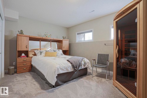 Soft gray wall paint, light neutral carpet, and white trim - 3815 41 Street Nw, Edmonton, AB 