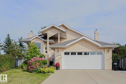Stucco exterior with multiple gables and a multi-level roofline - 3815 41 Street Nw, Edmonton, AB 