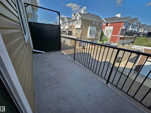 Private balcony with a dark privacy screen and black metal railing - #69 903 Crystallina Nera Wy Nw, Edmonton, AB 