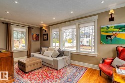 Living area featuring ornamental molding, wood finished floors, recessed lighting, and a textured ceiling - 