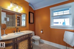 Full bathroom featuring ornamental molding, light tile patterned floors, vanity, plenty of natural light, and a shower - 