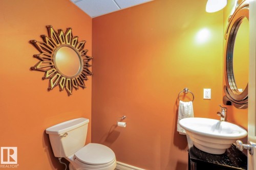 Half bathroom featuring toilet and vanity - 6306 111 Avenue Nw, Edmonton, AB 