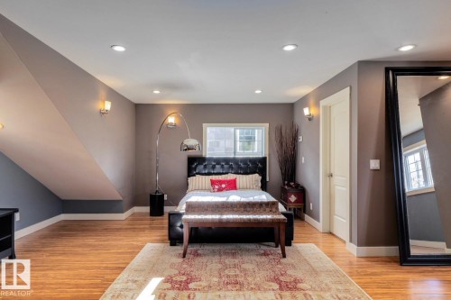 Living area featuring light wood-style flooring and recessed lighting - 6306 111 Avenue Nw, Edmonton, AB 