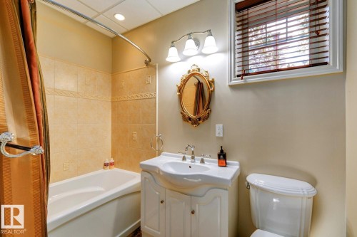 Full bath featuring washtub / shower combination and vanity - 6306 111 Avenue Nw, Edmonton, AB 