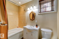 Full bath featuring washtub / shower combination and vanity - 