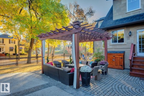 View of patio with an outdoor hangout area and a pergola - 6306 111 Avenue Nw, Edmonton, AB 