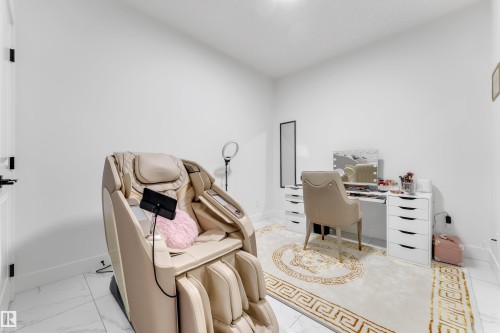 White walls with a smooth finish, recessed lighting, and white tile flooring - 6502 42 Ave, Beaumont, AB 