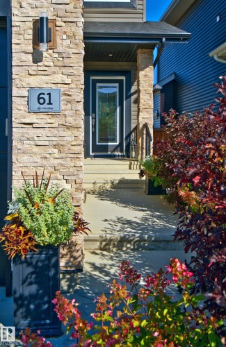 Stone facade with exterior lighting - 61 Encore Crescent, St. Albert, AB 