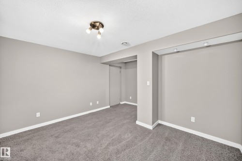 Neutral wall tones, recessed lighting, track lighting, and soft carpet flooring - 10715 133 Street Nw, Edmonton, AB 