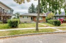 Stucco and brick exterior with a low-pitch roof - 10715 133 Street Nw, Edmonton, AB 