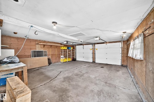 Two white garage doors - 10715 133 Street Nw, Edmonton, AB 
