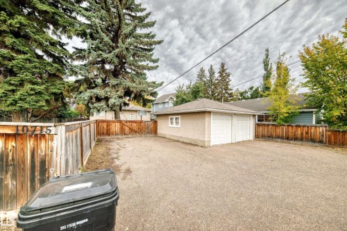 Two-car detached garage with stucco exterior and dual white garage doors - 10715 133 Street Nw, Edmonton, AB 
