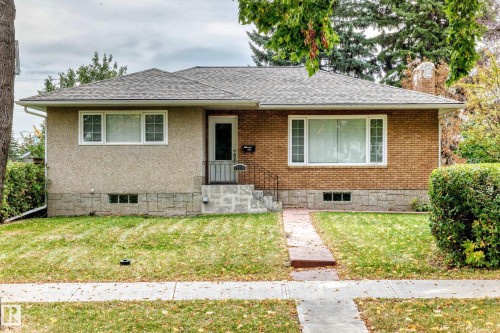 Brick and stucco exterior with a gray shingle roof - 10715 133 Street Nw, Edmonton, AB 