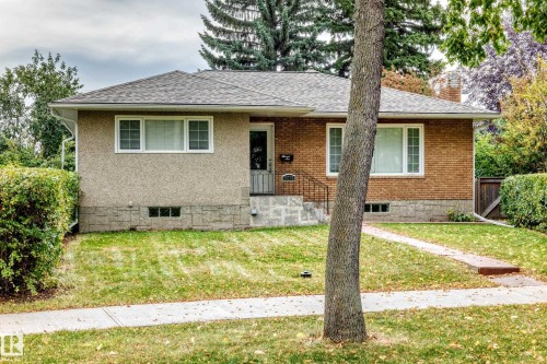Brick and stucco facade with a shingled roof - 10715 133 Street Nw, Edmonton, AB 