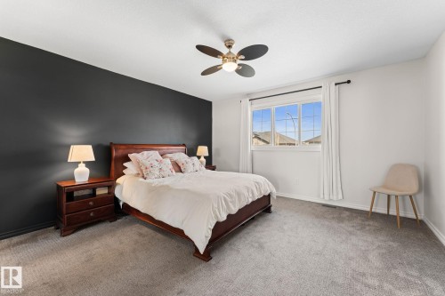 Recessed lighting, ceiling fan, carpeting, and a window with trim - #5 4900 62 St, Beaumont, AB 