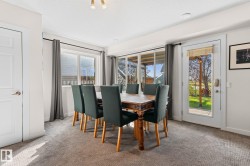 Recessed ceiling lighting, carpeted flooring, white paneled doors, and a glass-paned exterior door - 