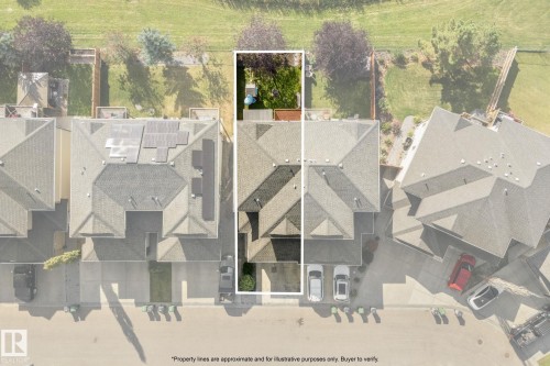 Gable roof residence featuring an attached garage and a fenced backyard with a manicured lawn - #5 4900 62 St, Beaumont, AB 
