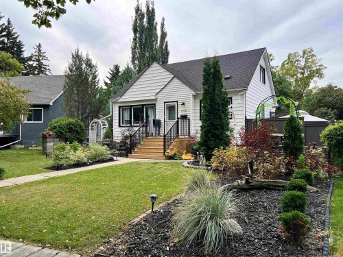 White siding exterior with black trim windows - 11908 131 Street Nw, Edmonton, AB 