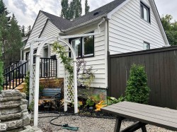 White horizontal siding exterior with black trim windows - 