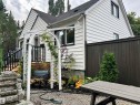 White horizontal siding exterior with black trim windows - 11908 131 Street Nw, Edmonton, AB 