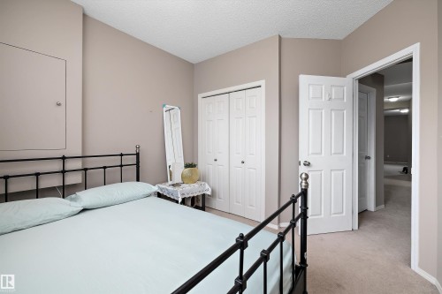 Neutral-toned walls complement the textured ceiling - 3114 32 Avenue Nw, Edmonton, AB 