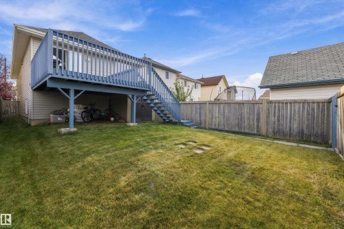 Expansive grassy yard with a multi-level deck and full perimeter fencing - 3114 32 Avenue Nw, Edmonton, AB 
