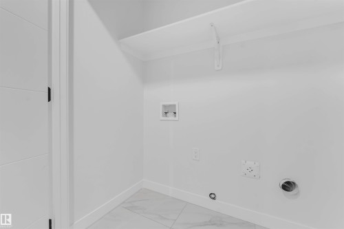 White wall-mounted shelving with support brackets - 523 Robinson Blvd, Leduc, AB 