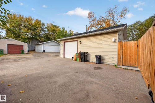 Multiple detached garages, paved driveway, and wood privacy fence - 9615 75 Avenue Nw, Edmonton, AB 