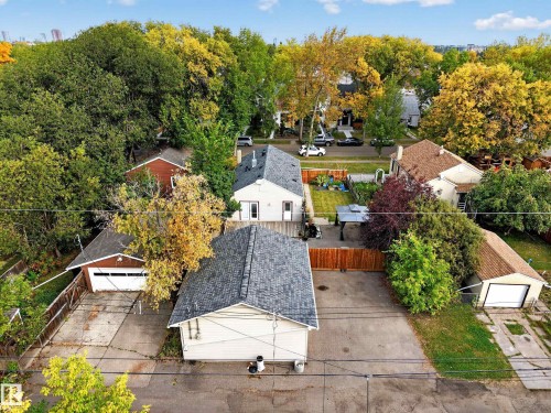 Expansive property with multiple detached garages, a spacious yard, and mature landscaping - 9615 75 Avenue Nw, Edmonton, AB 