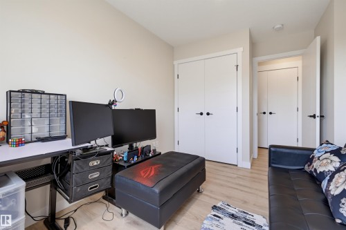 Light wood-finish flooring, white walls, and white trim - #3 150 Everitt Dr N, St. Albert, AB 