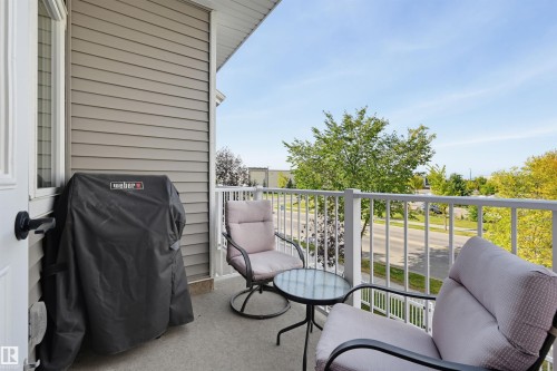 Outdoor balcony featuring light-toned siding and white railing - #3 150 Everitt Dr N, St. Albert, AB 