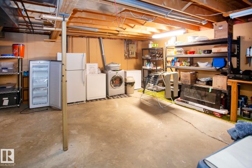 Exposed ceiling joists and concrete flooring - 8 Ash Crescent, St. Albert, AB 