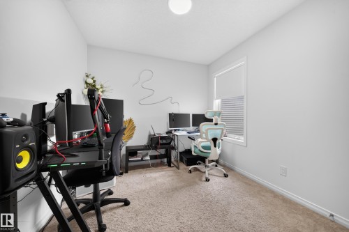 Recessed lighting, light-toned carpeting, and a window with horizontal blinds - 4104 3 Avenue Sw, Edmonton, AB 