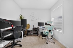 Carpeted flooring, white walls, and a window with blinds - 
