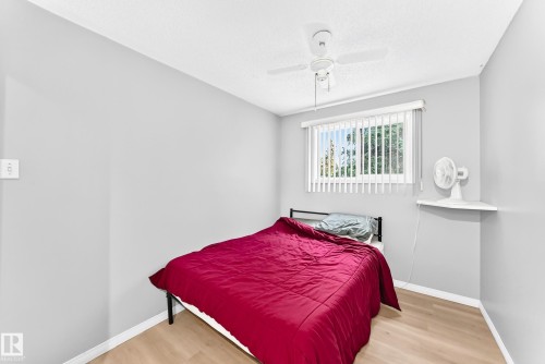 Light-toned walls with wood-finish flooring - 44 Habitat Crescent Nw, Edmonton, AB 