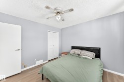 Wood-finish flooring with light gray wall paint - 