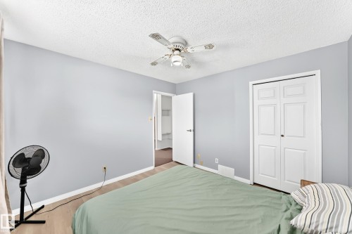 Light blue painted walls and wood-finish flooring - 44 Habitat Crescent Nw, Edmonton, AB 