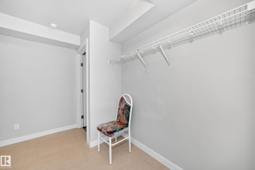 Recessed lighting, tile flooring, interior door, and wire shelving system - #39 7289 South Terwillegar Nw, Edmonton, AB 