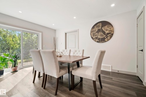 Recessed lighting, wood-finish flooring, sliding glass door, white trim, and white walls - 49279 Rge Rd 240, Rural Leduc County, AB 