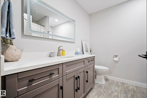 Modern vanity with gray shaker cabinetry and black hardware - 49279 Rge Rd 240, Rural Leduc County, AB 