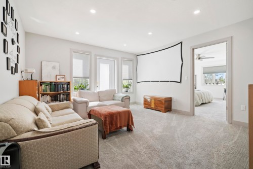 Recessed ceiling lighting, light gray wall paint, multiple windows, light gray carpet, and white trim - 49279 Rge Rd 240, Rural Leduc County, AB 