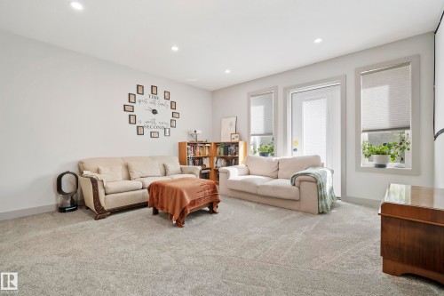 Recessed lighting illuminates the carpeted flooring and light-toned walls - 49279 Rge Rd 240, Rural Leduc County, AB 