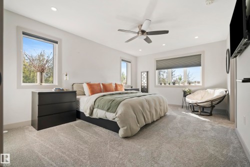 Recessed ceiling lighting, ceiling fan, multiple windows with roller shades, and light-toned carpeting - 49279 Rge Rd 240, Rural Leduc County, AB 